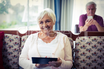 Senior woman using digital tablet