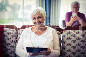 Senior woman using digital tablet