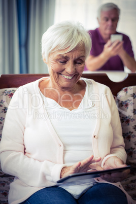 Senior woman using digital tablet