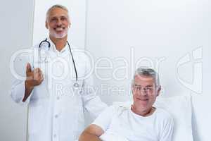 Portrait of happy male doctor and senior man