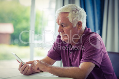 Senior man using mobile phone