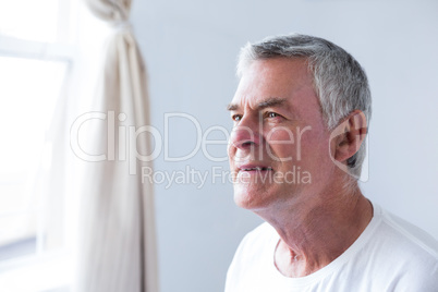 Thoughtful senior man in bedroom