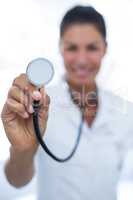Female doctor showing stethoscope