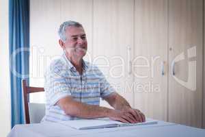 Blind man reading a braille book