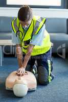 Female paramedic during cardiopulmonary resuscitation training