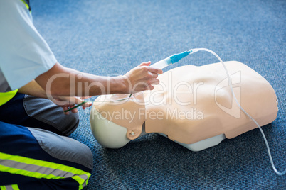 Female paramedic during cardiopulmonary resuscitation training