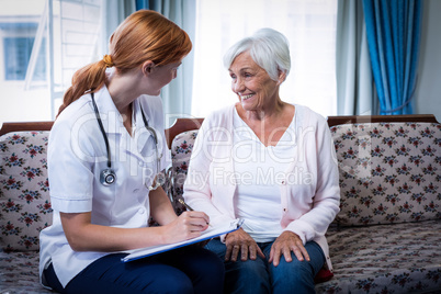 Doctor consulting with senior woman