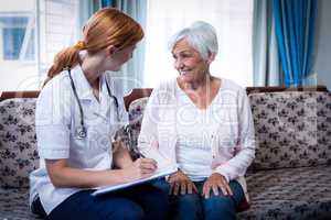 Doctor consulting with senior woman