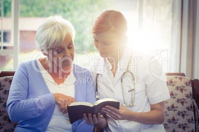 Doctor and patient reading a book