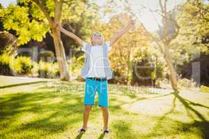 Excited young boy in park