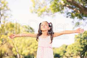 Young girl with arms outstretched