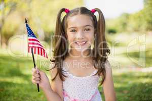 Girl holding an American flag