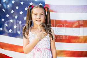 Young girl in front of American flag