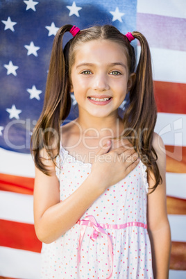 Young girl in front of American flag