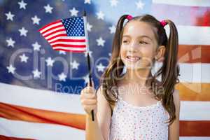 Young girl holding American flag