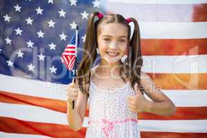 Young girl holding American flag