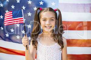 Young girl holding American flag