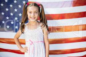 Young girl in front of American flag