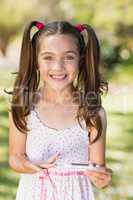 Girl testing diabetes on glucose meter