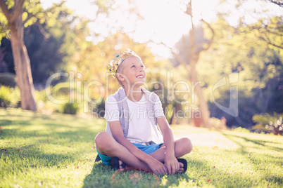 Young boy sitting in park