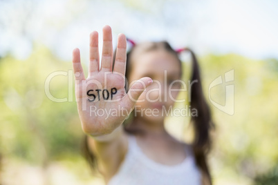 Girl making stop sign with her hand