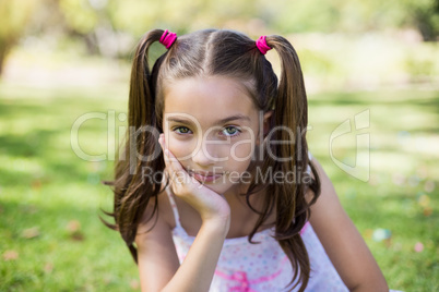 Upset girl sitting with hand on chin