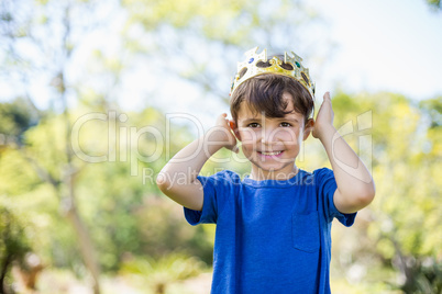 Young boy wearing a crown