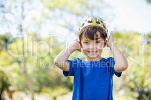 Young boy wearing a crown