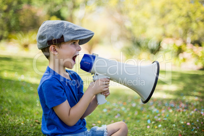 Young boy speaking on megaphone