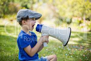 Young boy speaking on megaphone