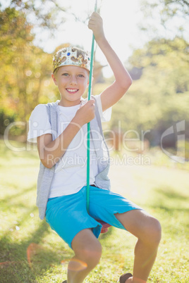 Boy swinging on swing