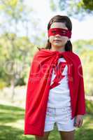 Young girl pretending to be a superhero