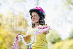 Smiling girl riding a bicycle