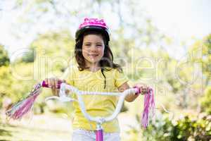 Smiling girl riding a bicycle