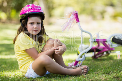 Young girl getting injured after falling from bicycle