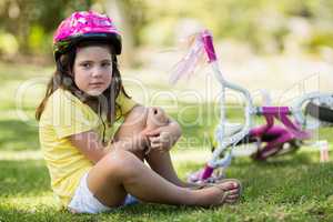 Young girl getting injured after falling from bicycle