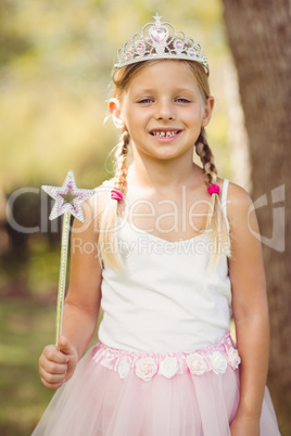 Young girl pretending to be a fairy