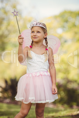 Young girl pretending to be a fairy