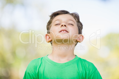 Young boy with eyes closed