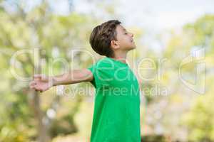 Young boy with arms outstretched