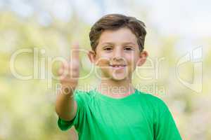 Young boy giving a thumbs up