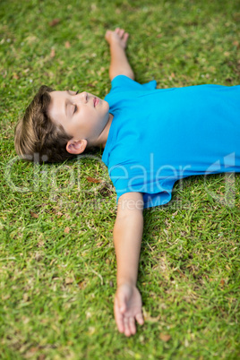 Young boy sleeping in park