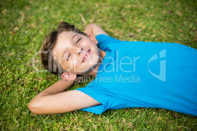 Young boy sleeping in park