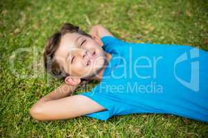 Young boy sleeping in park