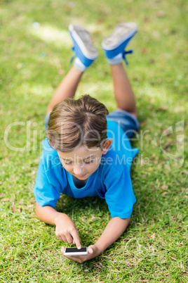 Young boy using mobile phone