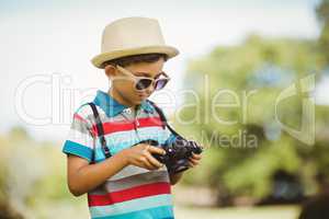 Young boy checking a photograph in camera