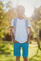 Smiling boy standing with hands in pocket