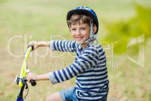 Portrait of smiling boy riding a bicycle