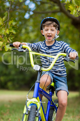 Portrait of smiling boy riding a bicycle