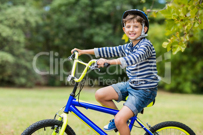 Portrait of smiling boy riding a bicycle